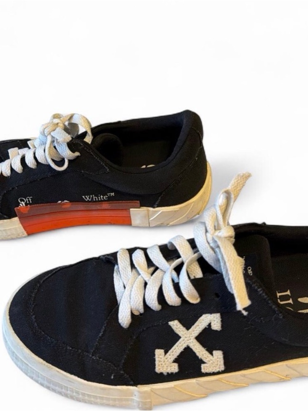 black off white canvas sneakers.